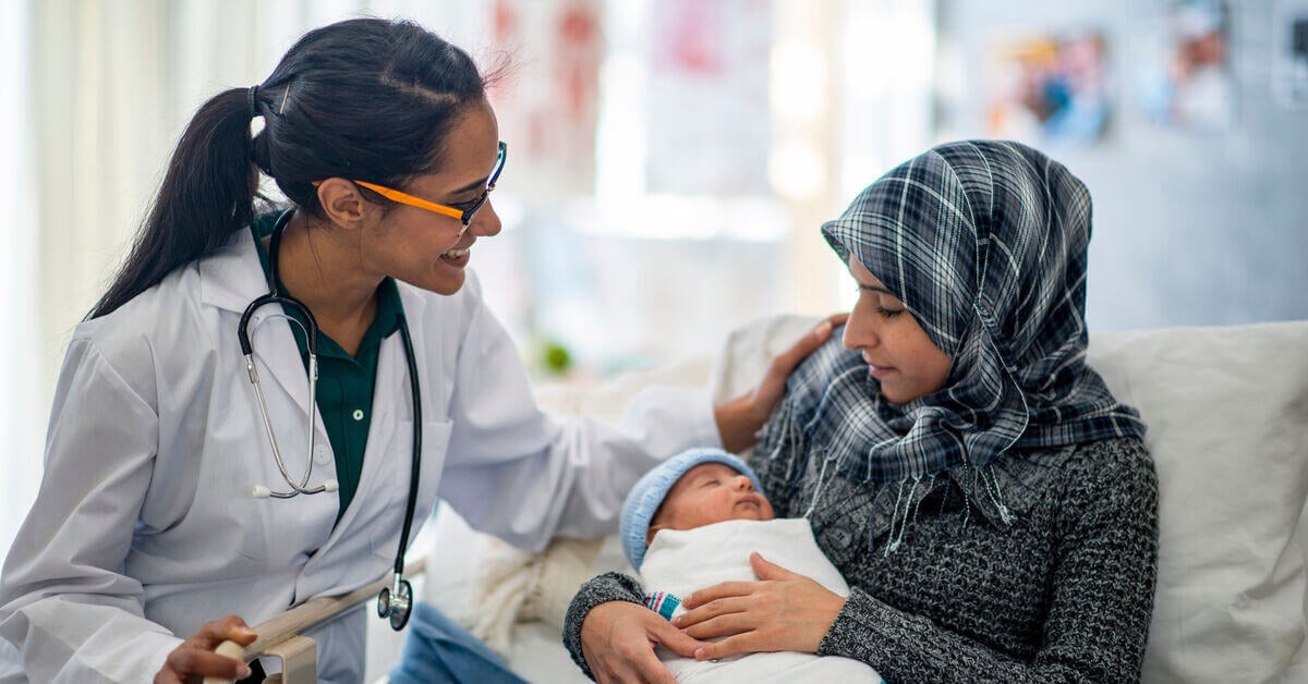 DNP with a patient and a newborn baby