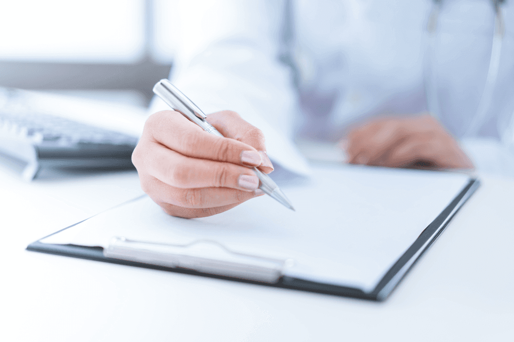 NP writing on a clipboard