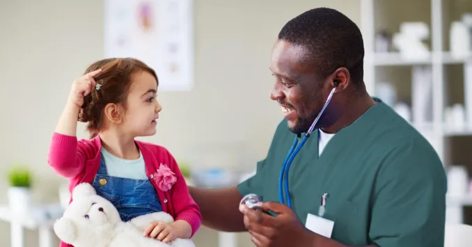 nurse with a pediatric patient